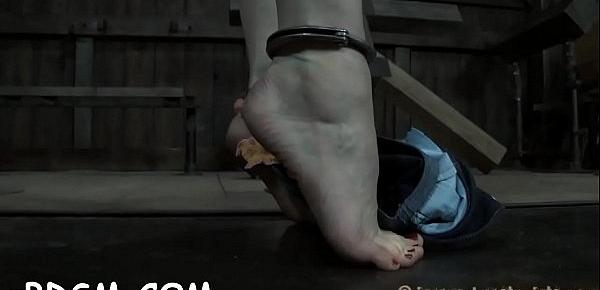  Bounded playgirl receives a painful and pricky feet worshipping